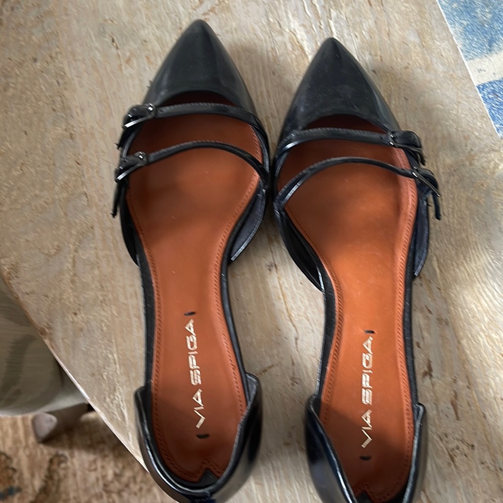 Brand new never worn via spits black flats will dress up any outfit!